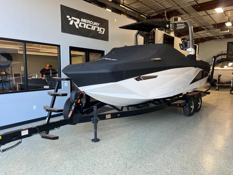 Slide: The Image of 2023 Nautique Super Air G23 boat on trailer in showroom. - 49