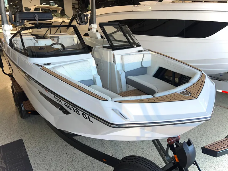 Slide: The Image of 2023 Nautique Super Air G23 boat displayed in showroom, featuring sleek design and modern amenities. - 5