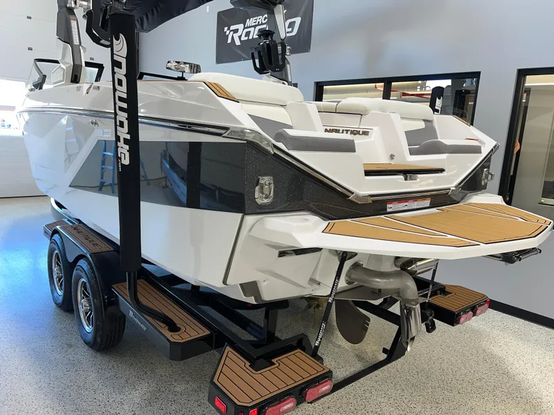 Slide: The Image of 2023 Nautique Super Air G23 boat on trailer in showroom. - 6