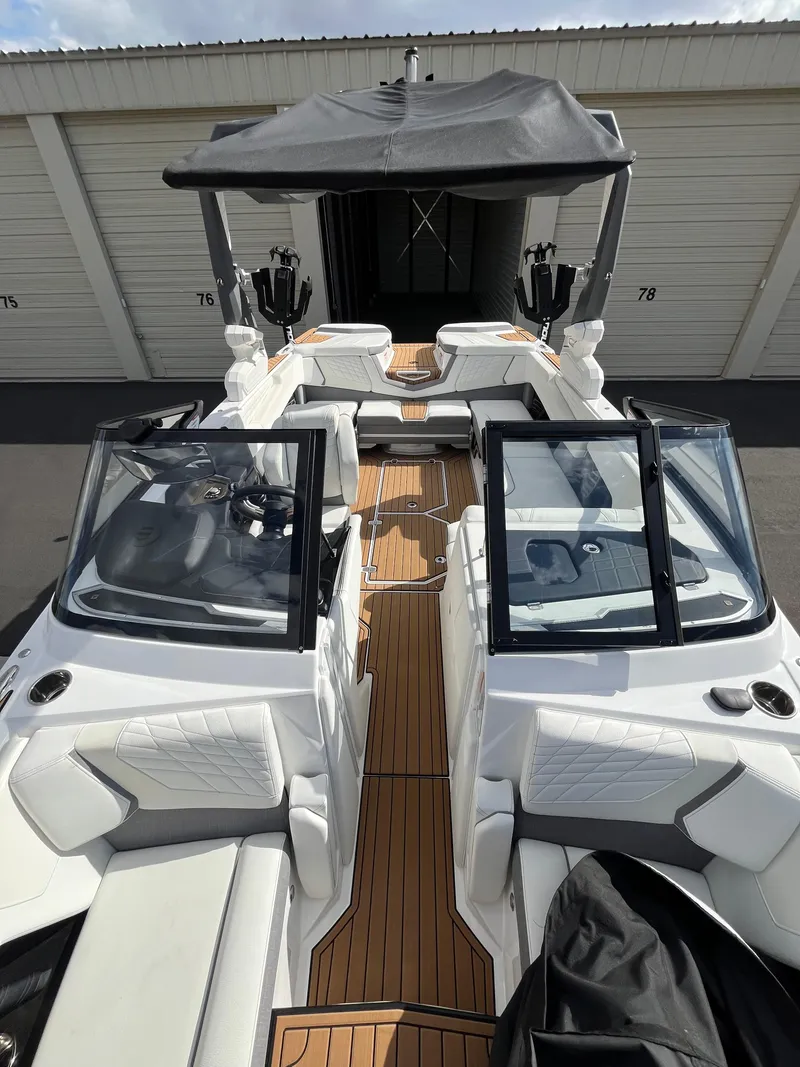 Slide: The Image of 2023 Nautique Super Air G23 boat with sleek design and spacious seating. - 68