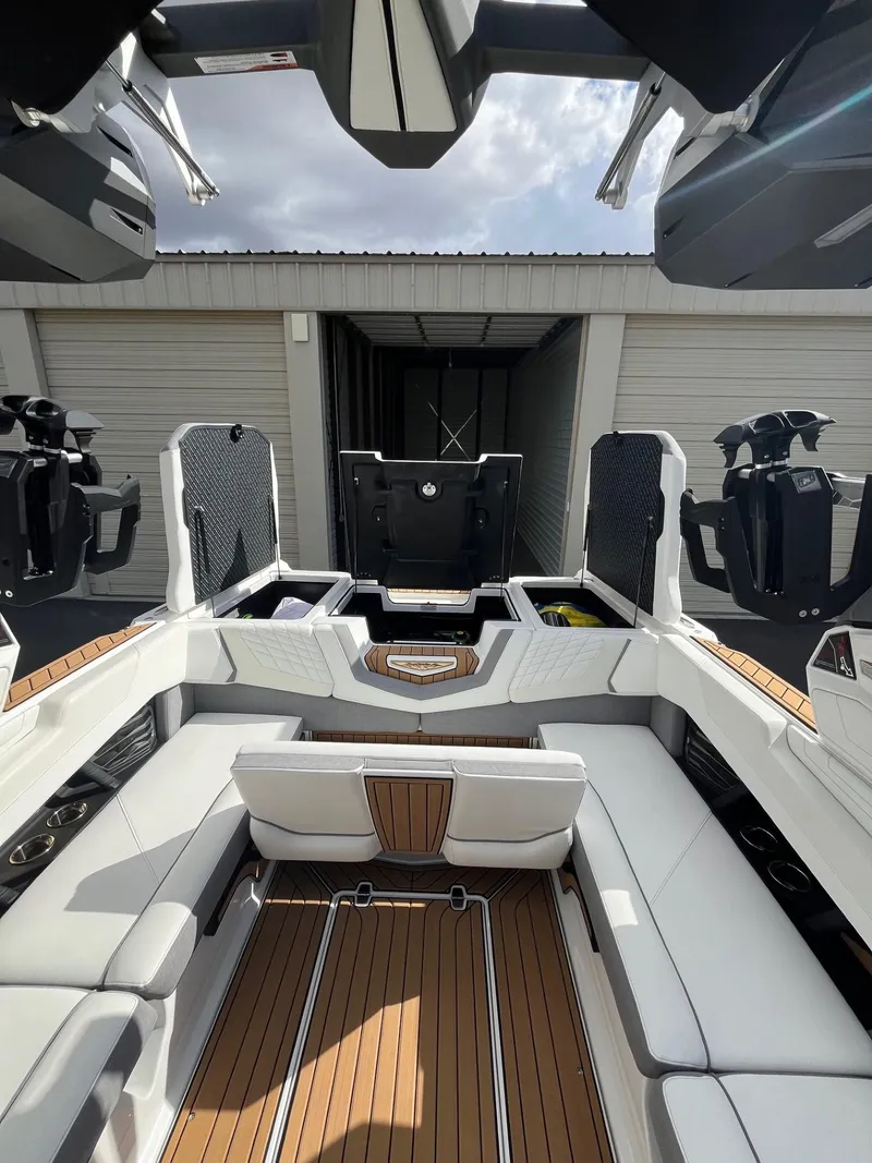 Slide: The Image of 2023 Nautique Super Air G23 boat interior with sleek seating and modern design. - 76
