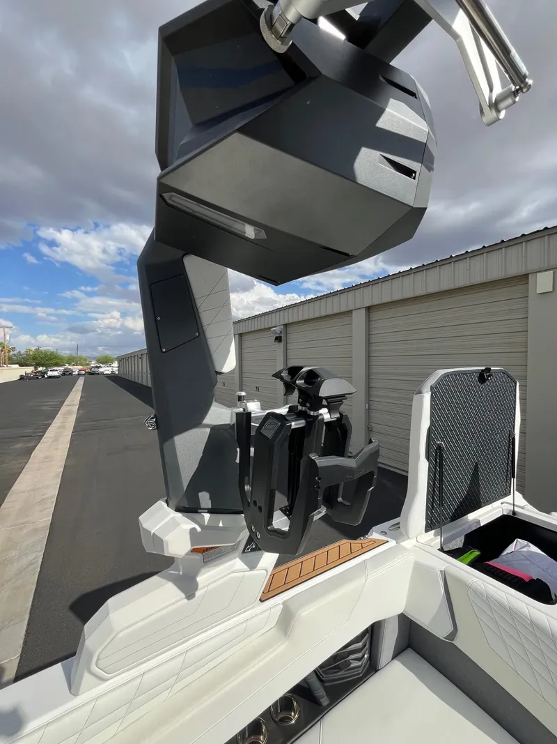 Slide: The Image of 2023 Nautique Super Air G23 boat with advanced wakeboard tower in storage area. - 78