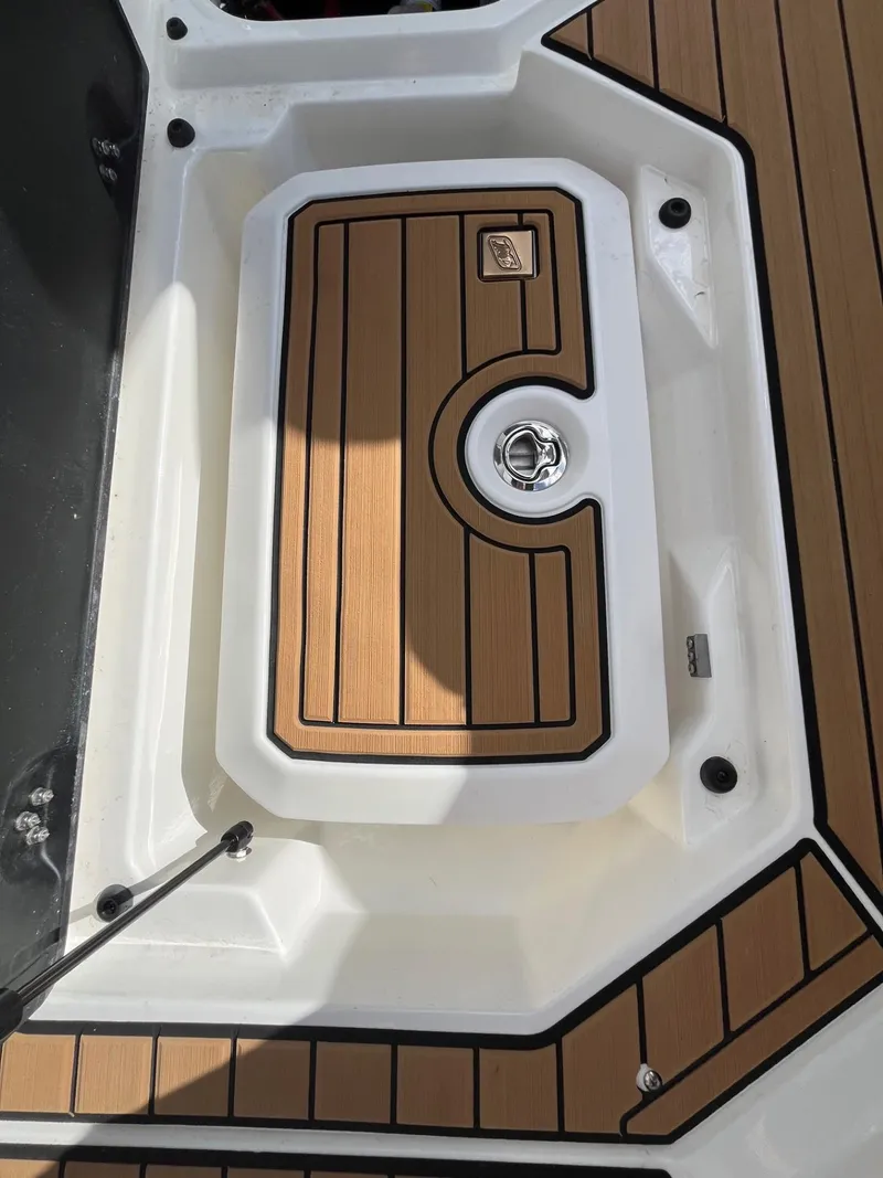 Slide: The Image of 2023 Nautique Super Air G23 boat deck with teak-style finish. - 88