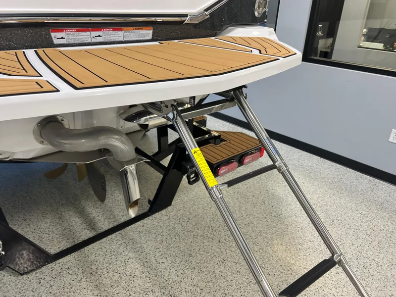 Slide: The Image of 2023 Nautique Super Air G23 boat with swim platform and retractable ladder. - 9