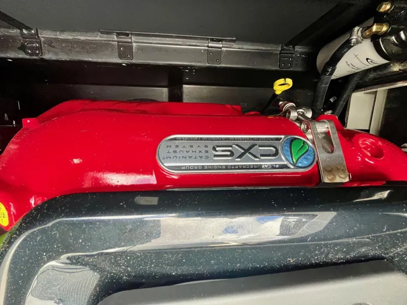 Slide: The Image of 2023 Nautique Super Air G23 engine with red cover and CXS branding. - 90