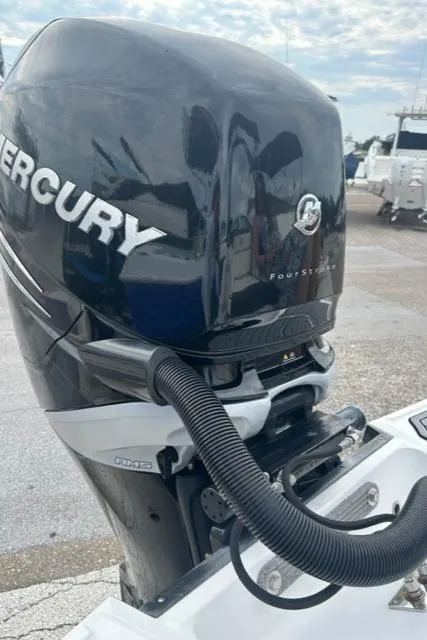 Slide: The Image of Mercury outboard motor on a 2018 Monterey M45 boat, docked outdoors. - 10