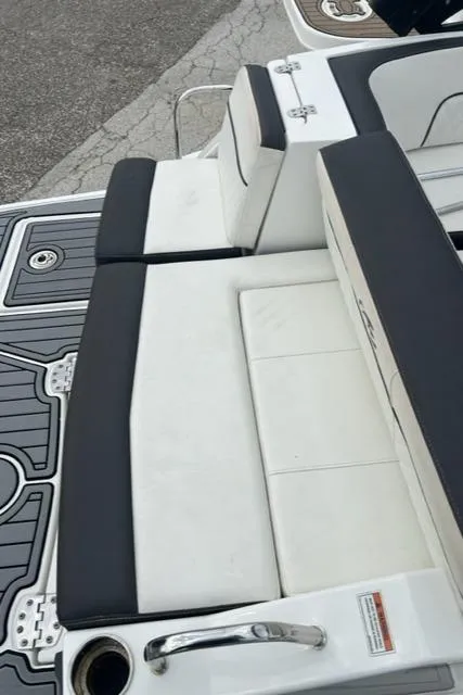 Slide: The Image of 2018 Monterey M45 boat with white and black seating on deck. - 13