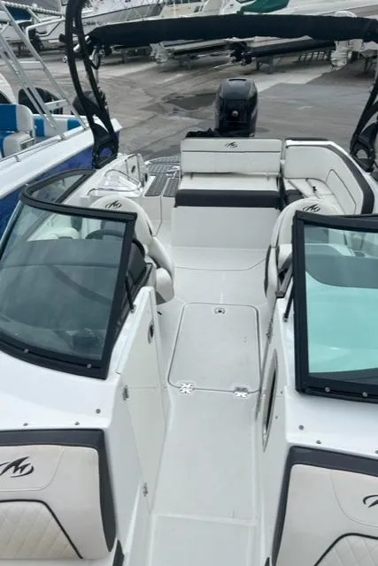Slide: The Image of 2018 Monterey M45 boat interior with seating and windshield, docked at marina. - 14
