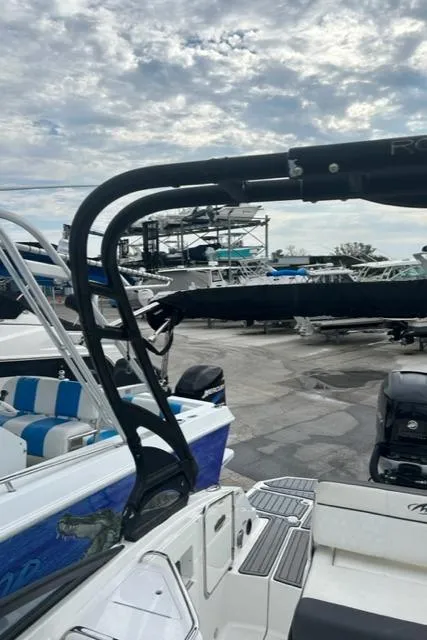 Slide: The Image of 2018 Monterey M45 boat with sleek design, docked under cloudy sky. - 15