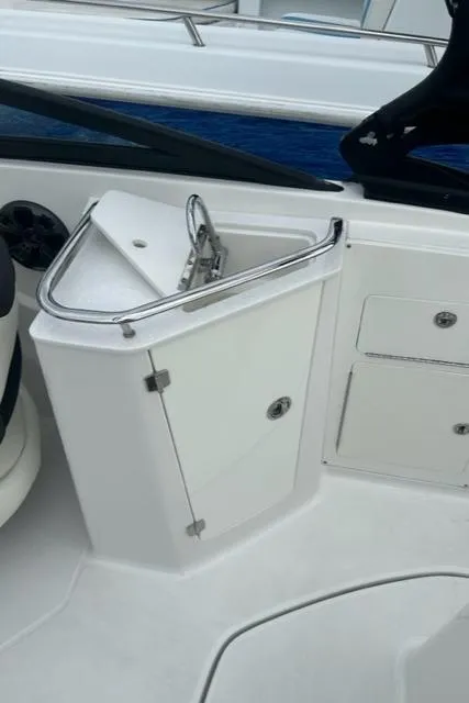 Slide: The Image of 2018 Monterey M45 boat interior with storage compartment and sleek design. - 24