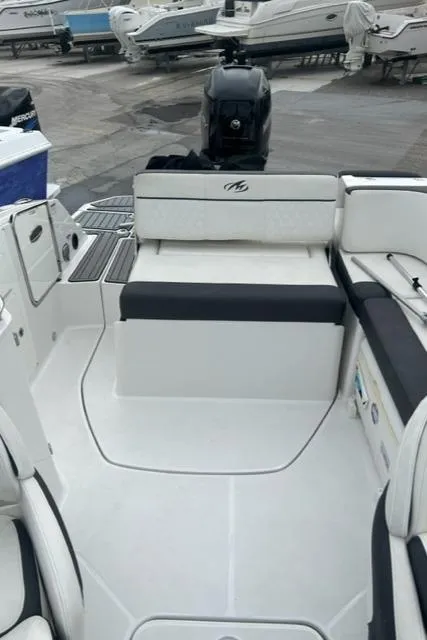 Slide: The Image of 2018 Monterey M45 boat interior with seating and motor, docked at marina. - 26