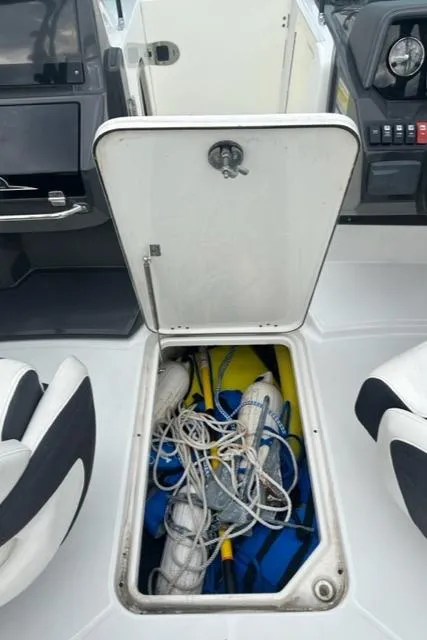 Slide: The Image of Open storage compartment on 2018 Monterey M45 boat with ropes and life jackets. - 27