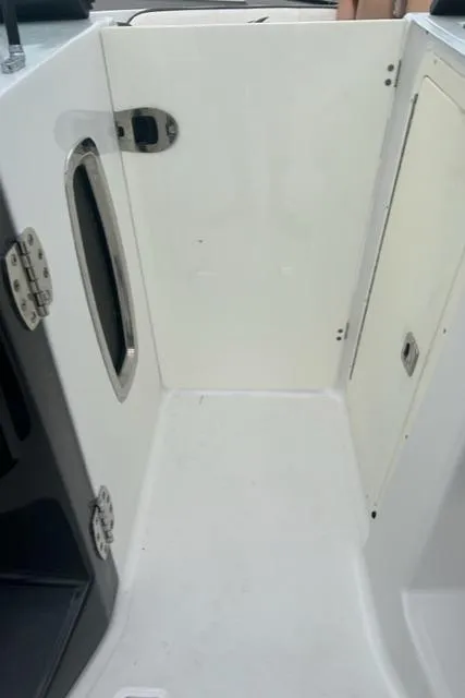 Slide: The Image of Interior view of a 2018 Monterey M45 boat, featuring a white cabin area. - 28