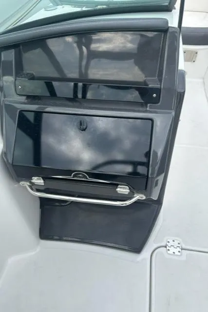 Slide: The Image of 2018 Monterey M45 boat dashboard with sleek black finish and chrome handle. - 31