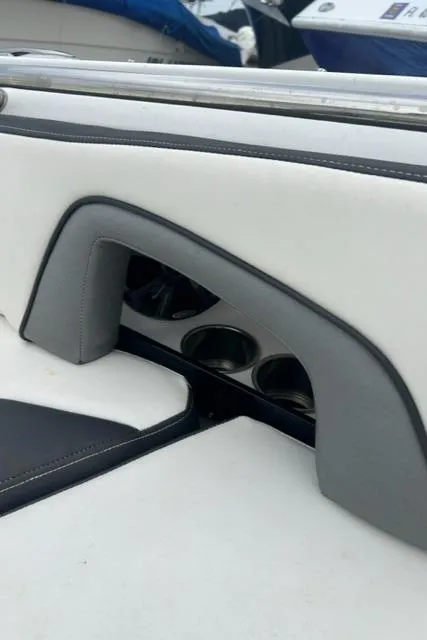Slide: The Image of 2018 Monterey M45 boat interior with cup holders and cushioned seating. - 36