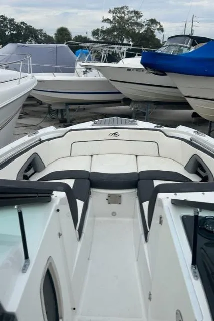 Slide: The Image of 2018 Monterey M45 boat in marina, surrounded by other vessels. - 39