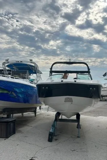 Slide: The Image of 2018 Monterey M45 boat on trailer under cloudy sky. - 4
