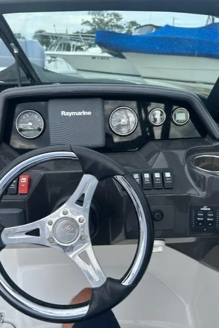 Slide: The Image of 2018 Monterey M45 boat dashboard with steering wheel and Raymarine navigation system. - 6