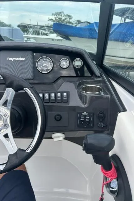 Slide: The Image of Monterey M45 2018 boat dashboard with steering wheel and control panel. - 8