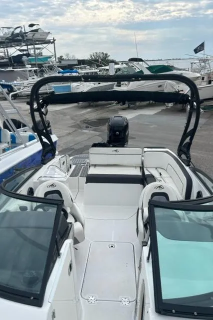 Slide: The Image of 2018 Monterey M45 boat with open deck and seating, docked at marina. - 9