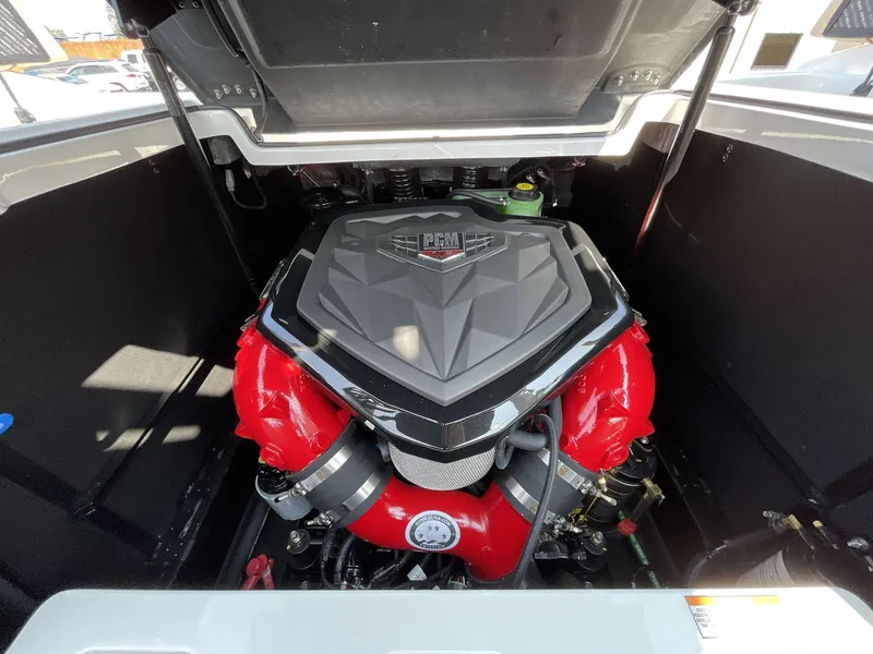 Slide: The Image of 2025 Nautique Super Air S S23 engine with red components and PCM branding. - 21