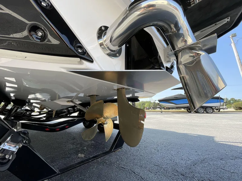 Slide: The Image of Close-up of 2025 Nautique Super Air S S23 boat propeller and exhaust system. - 34