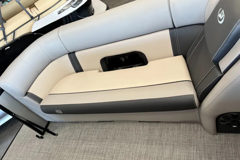 Slide: The Image of 2024 Princecraft Quorum 23 RL boat interior with beige and gray seating. - 12