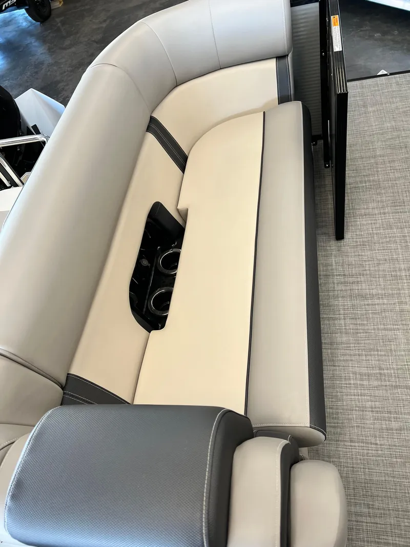 Slide: The Image of 2024 Princecraft Quorum 23 RL boat seating with cup holders, featuring sleek, modern design. - 14