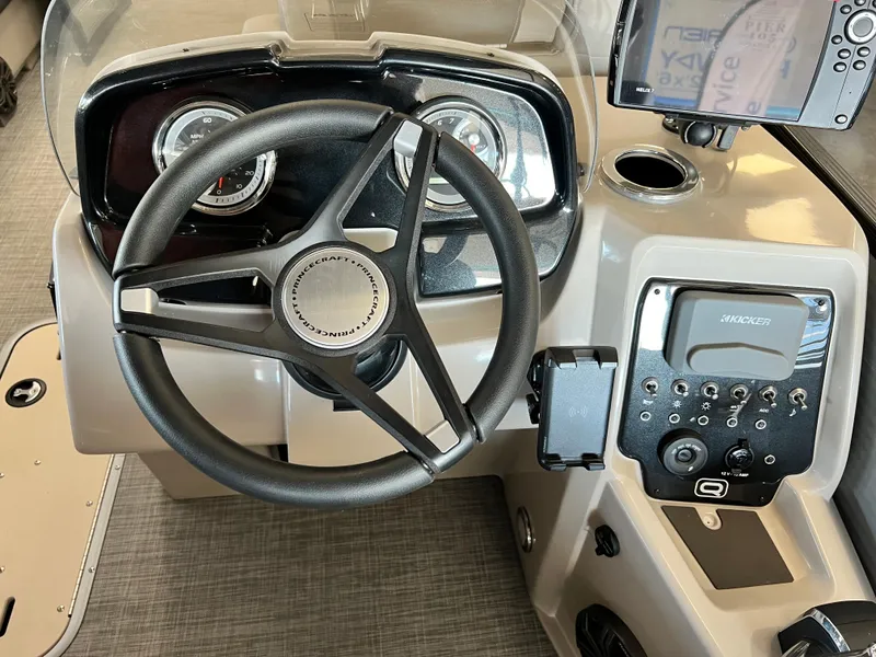 Slide: The Image of 2024 Princecraft Quorum 23 RL dashboard with steering wheel and control panel. - 6