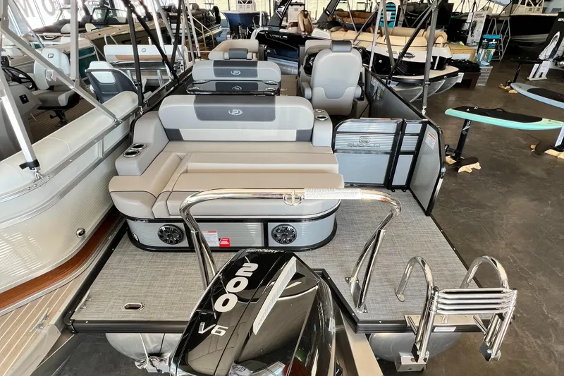 Slide: The Image of 2024 Princecraft Quorum 23 RL pontoon boat with spacious seating and powerful 200 V6 engine. - 7