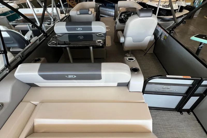 Slide: The Image of 2024 Princecraft Quorum 23 RL pontoon boat interior with seating and table. - 8