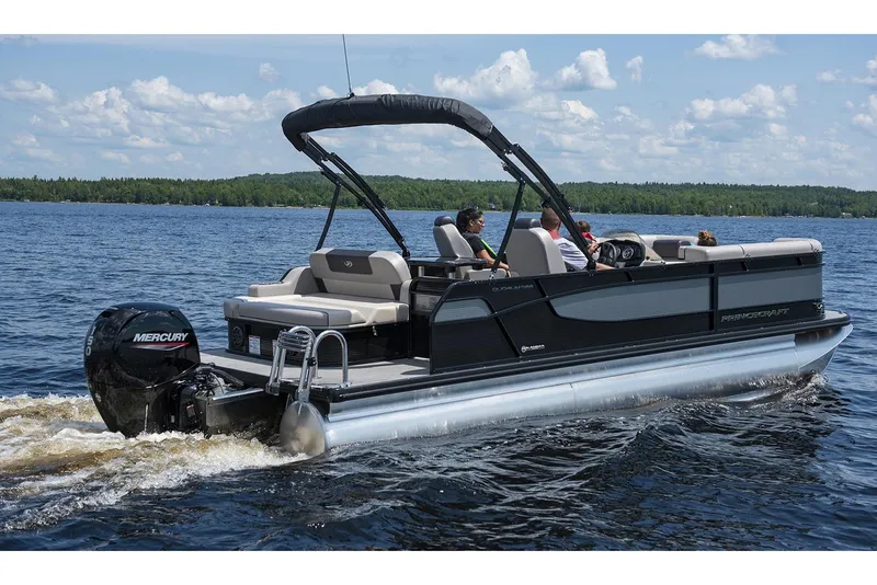 The Image of 2024 Princecraft Quorum 23 RL pontoon boat on trailer, parked outside dealership. - 0