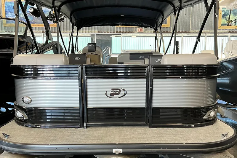 Slide: The Image of 2024 Princecraft Quorum 23 RL boat interior with seating and table. - 10