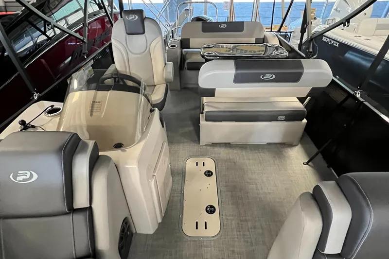 Slide: The Image of 2024 Princecraft Quorum 23 RL with Mercury outboard motor, side view. - 13