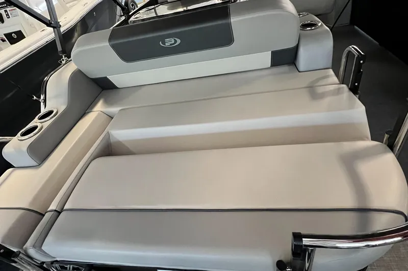 Slide: The Image of 2024 Princecraft Quorum 23 RL boat interior with seating and cup holders. - 16