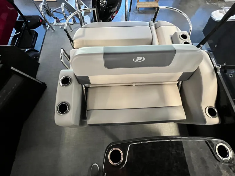 Slide: The Image of 2024 Princecraft Quorum 23 RL pontoon boat interior with seating and canopy. - 7