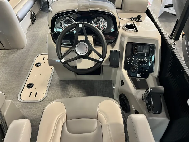 Slide: The Image of 2024 Princecraft Quorum 23 RL boat interior with gray and white cushioned seating. - 8