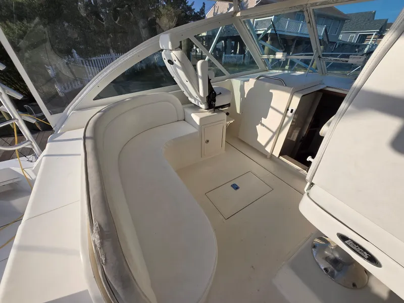 Slide: The Image of 2007 Carolina Classic 35 boat interior with curved seating and helm station. - 11