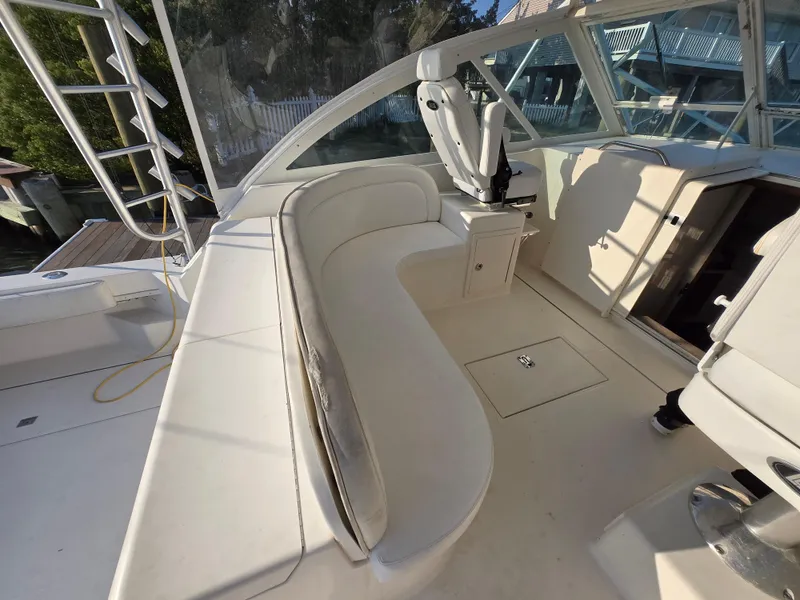Slide: The Image of 2007 Carolina Classic 35 boat interior with white seating and helm station. - 16