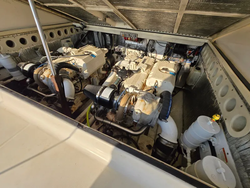 Slide: The Image of Engine compartment of a 2007 Carolina Classic 35 boat, showcasing dual engines. - 17