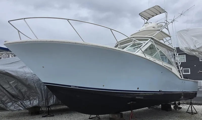 Slide: The Image of 2007 Carolina Classic 35 boat on dry dock, overcast sky background. - 26