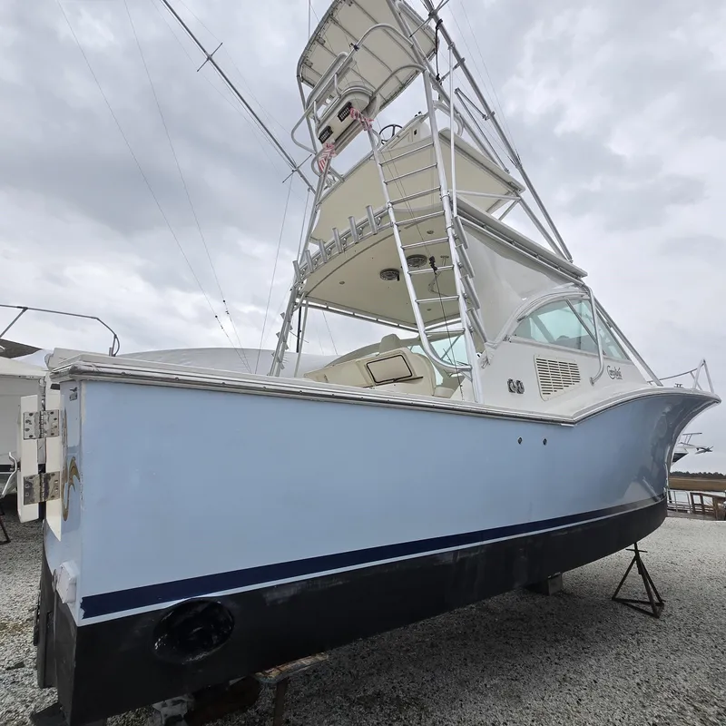 Slide: The Image of 2007 Carolina Classic 35 boat with tower, displayed on gravel under cloudy sky. - 28
