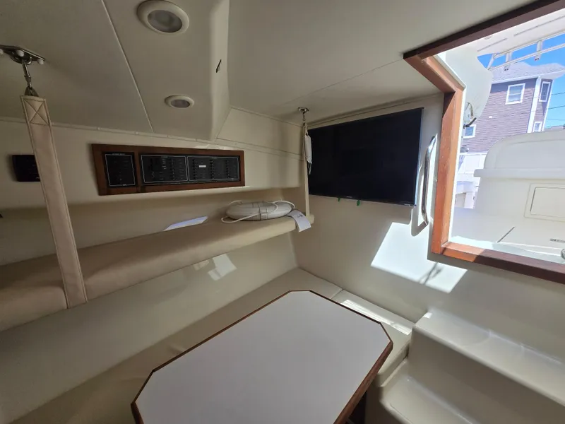 Slide: The Image of Interior of 2007 Carolina Classic 35 boat with seating and window view. - 32