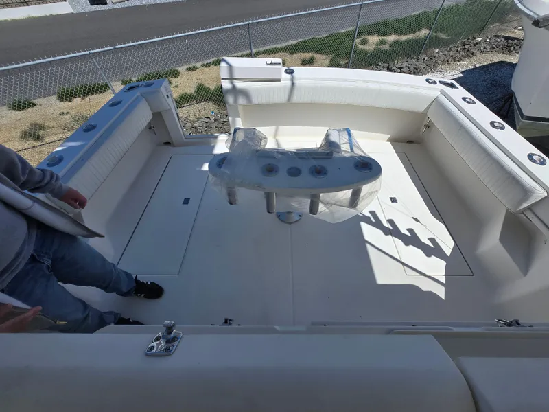 Slide: The Image of 2007 Carolina Classic 35 boat deck with seating and fishing rod holders. - 34