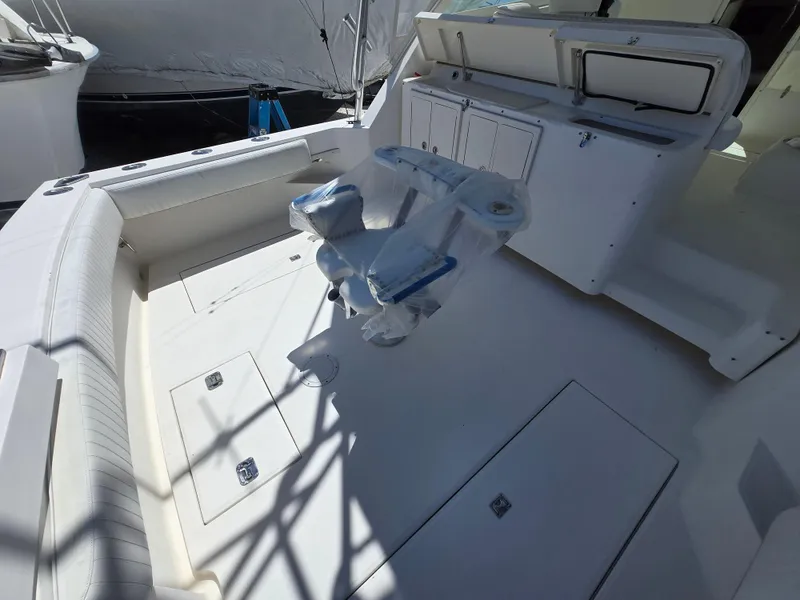 Slide: The Image of 2007 Carolina Classic 35 boat interior with seating and storage compartments. - 40