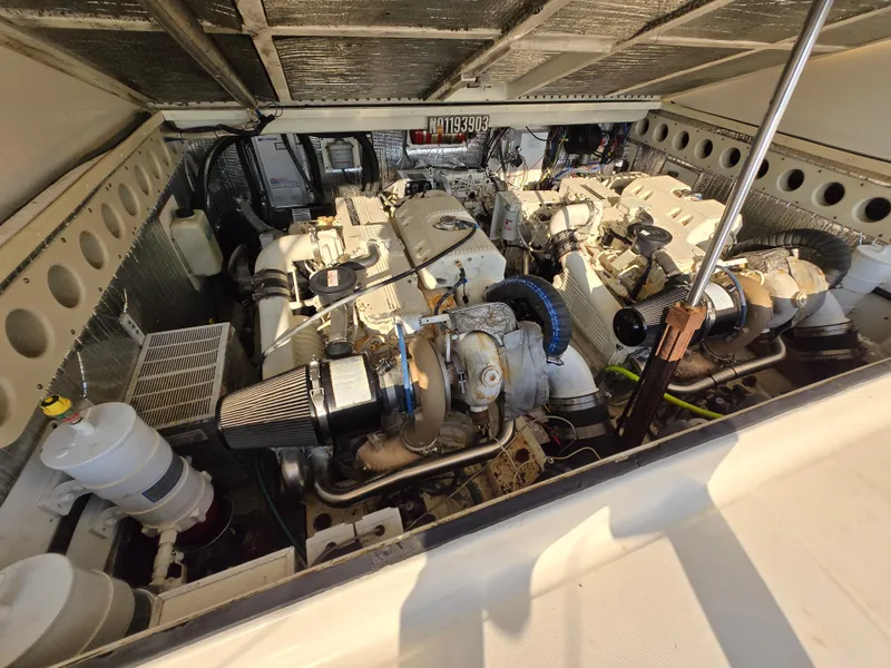 Slide: The Image of Engine compartment of a 2007 Carolina Classic 35 boat, showcasing dual engines and components. - 8