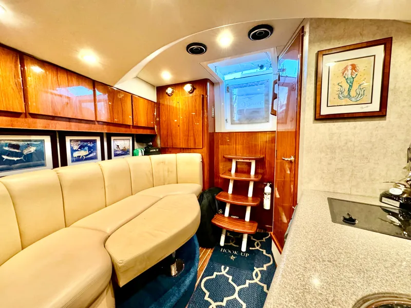 Slide: The Image of Luxurious interior of a 2004 Predator 35 yacht with elegant seating and wooden accents. - 26