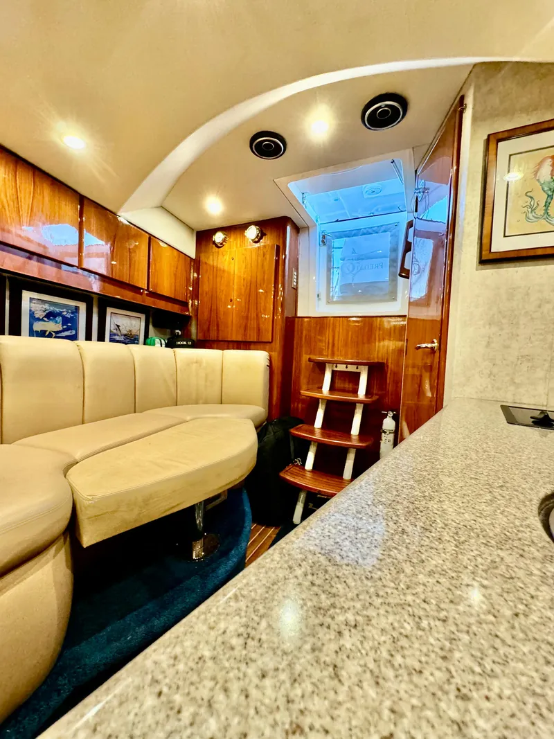 Slide: The Image of Luxurious interior of a 2004 Predator 35 yacht with plush seating and elegant wood finishes. - 27