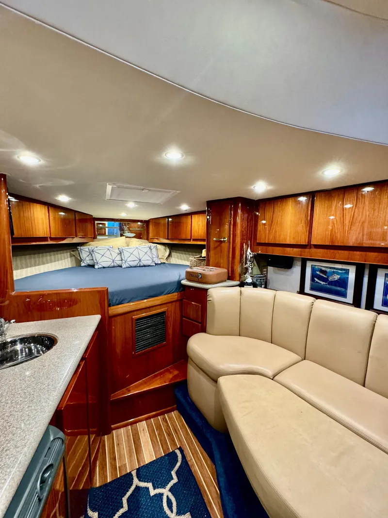 Slide: The Image of Luxurious interior of a 2004 Predator 35 yacht with wood finishes and cozy seating. - 3