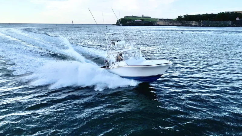 Slide: The Image of Luxurious interior of a 2004 Predator 35 yacht with wood finishes and cozy seating. - 30